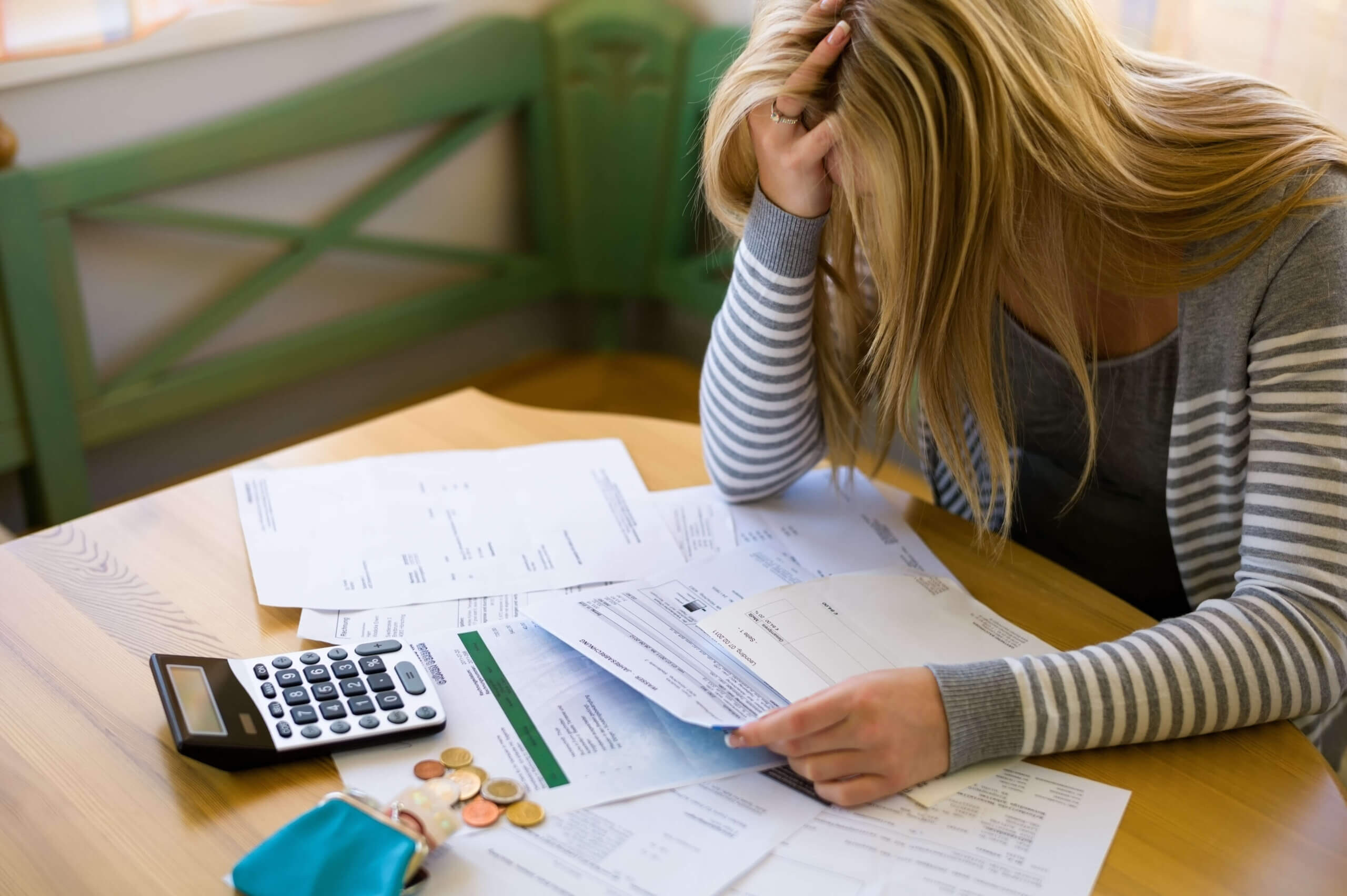 women overwhelmed by bills and debt