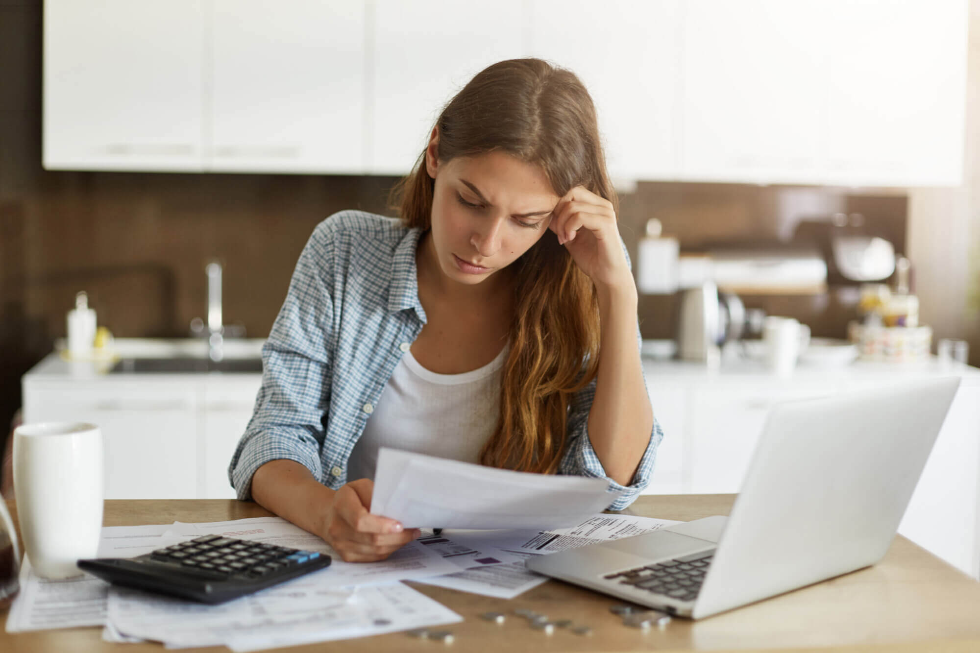 woman looking at bankruptcy papers
