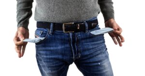 bankrupt person with no money in pockets