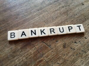 bankrupt spelled out in letter tiles
