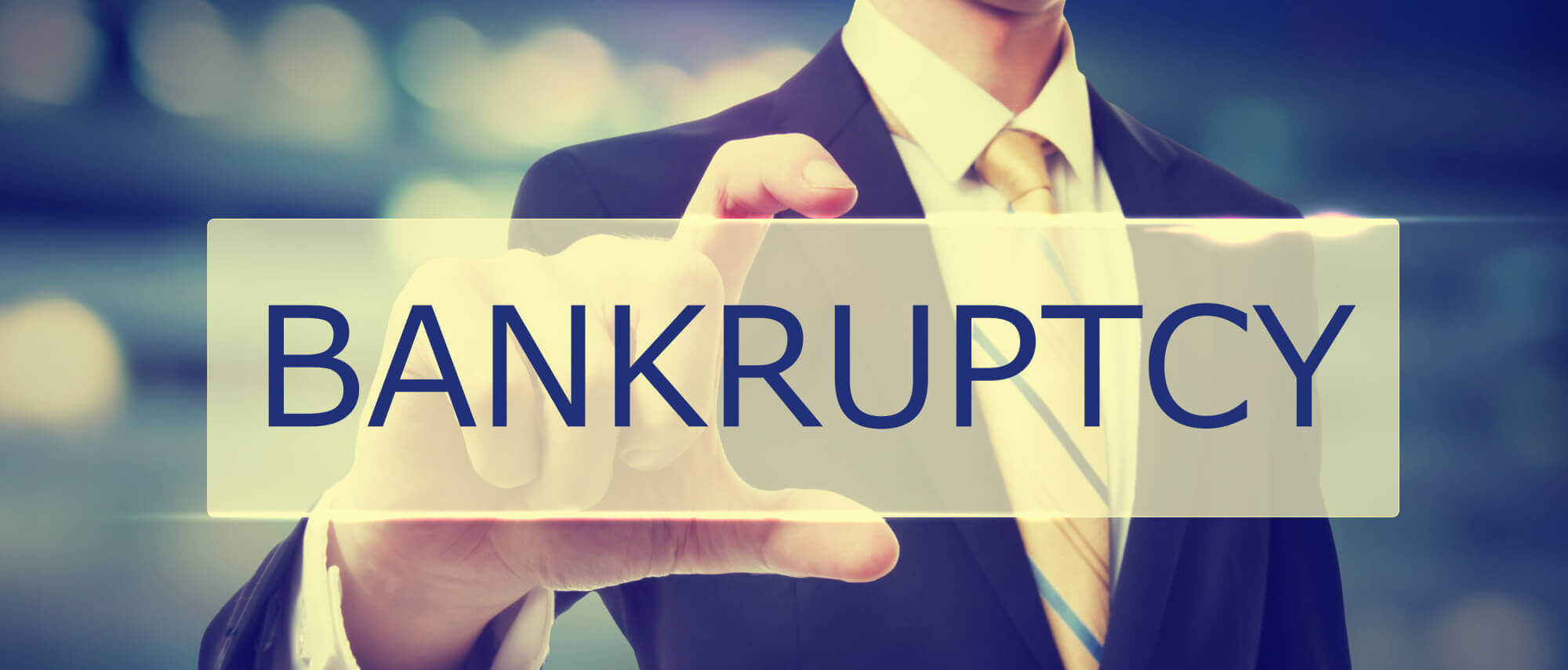 Business man holding Bankruptcy sign