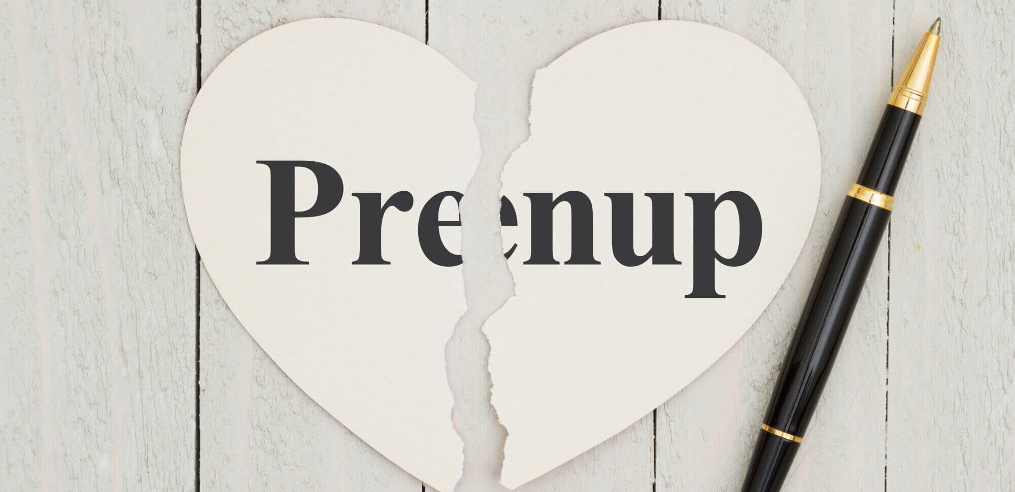 prenup text on heart with pen